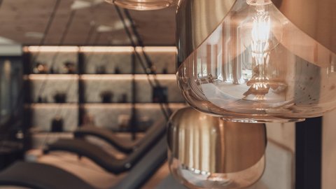 Pictures from Sportalm Modern pendant lights in a cozy interior with lounge chairs