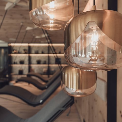 Pictures from Sportalm Modern pendant lights in a cozy interior with lounge chairs