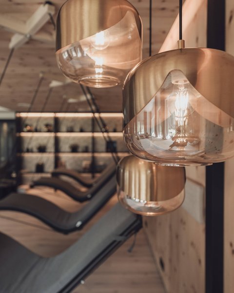 Pictures from Sportalm Modern pendant lights in a cozy interior with lounge chairs