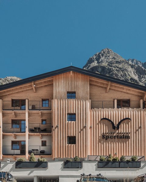 Pictures from Sportalm Alpine resort Sportalm with mountains in the background and parked cars