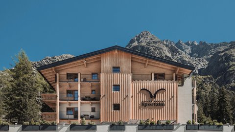 Pictures from Sportalm Alpine resort Sportalm with mountains in the background and parked cars