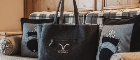 Pictures from Sportalm Felt bag with Alpine Resort Sportalm logo on cozy couch