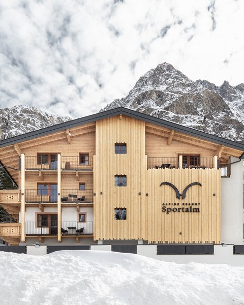 Pictures from Sportalm Alpine resort Sportalm with snowy mountains and forest background