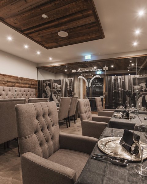 Pictures from Sportalm Elegant restaurant room with comfortable chairs and set dining tables