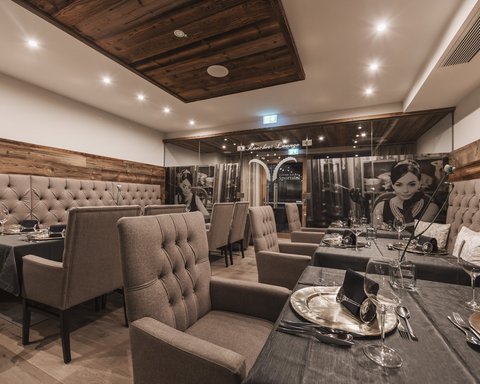 Pictures from Sportalm Elegant restaurant room with comfortable chairs and set dining tables