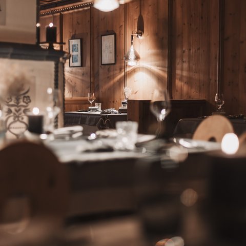 Pictures from Sportalm Cozy restaurant with wooden walls and candlelit set tables