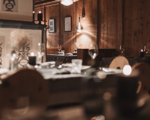 Pictures from Sportalm Cozy restaurant with wooden walls and candlelit set tables