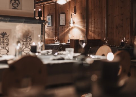 Pictures from Sportalm Cozy restaurant with wooden walls and candlelit set tables