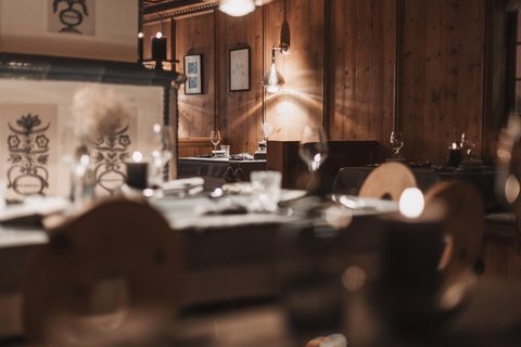 Pictures from Sportalm Cozy restaurant with wooden walls and candlelit set tables