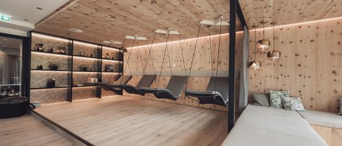 Pictures from Sportalm Modern relaxation room with wooden ceiling, hanging loungers, and comfortable sofas