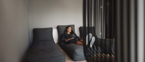 Pictures from Sportalm Woman relaxing on gray lounge chair in modern room