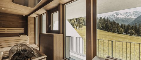 Pictures from Sportalm Sauna with large windows overlooking snow-capped mountain peaks