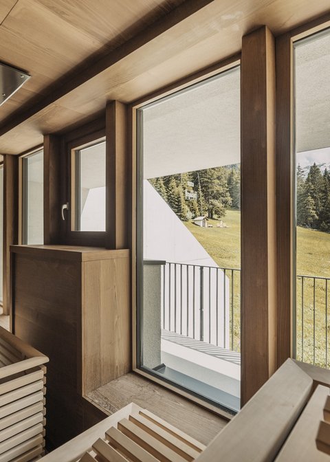 Pictures from Sportalm Sauna with large windows overlooking snow-capped mountain peaks