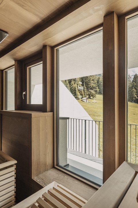 Pictures from Sportalm Sauna with large windows overlooking snow-capped mountain peaks
