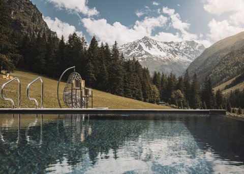 Pictures from Sportalm Pool with mountain view and hanging wicker chair on a sunny day