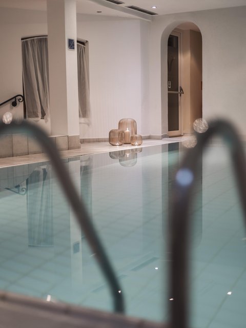 Pictures from Sportalm Indoor pool with candles in decorative lanterns on the floor