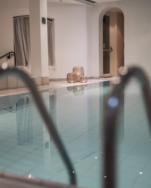 Pictures from Sportalm Indoor pool with candles in decorative lanterns on the floor