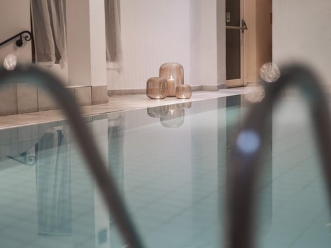 Pictures from Sportalm Indoor pool with candles in decorative lanterns on the floor