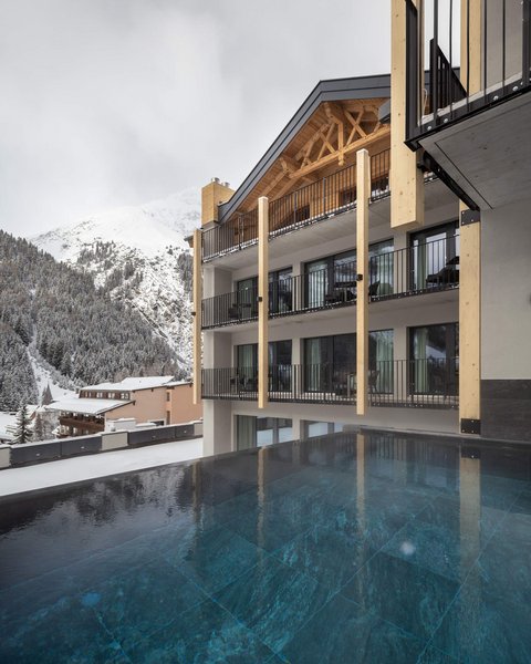 Pictures from Sportalm Modern lodge with pool and snow-covered mountains in the background