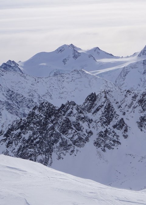 Pictures from Sportalm Snow-covered mountain peaks under a cloudy sky