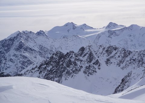 Pictures from Sportalm Snow-covered mountain peaks under a cloudy sky