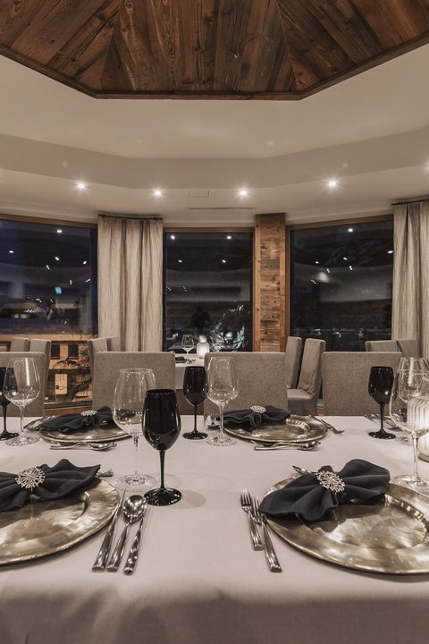 Pictures from Sportalm Elegant restaurant with set table and candlelight at night