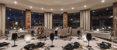 Pictures from Sportalm Elegant restaurant with set table and candlelight at night