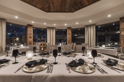 Pictures from Sportalm Elegant restaurant with set table and candlelight at night