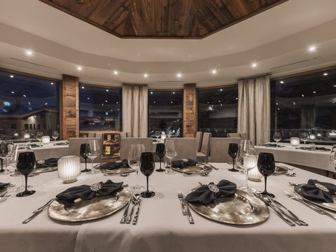 Pictures from Sportalm Elegant restaurant with set table and candlelight at night