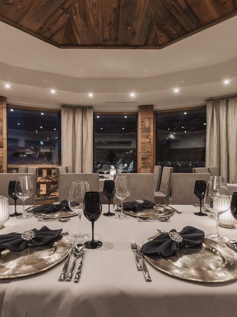 Pictures from Sportalm Elegant restaurant with set table and candlelight at night