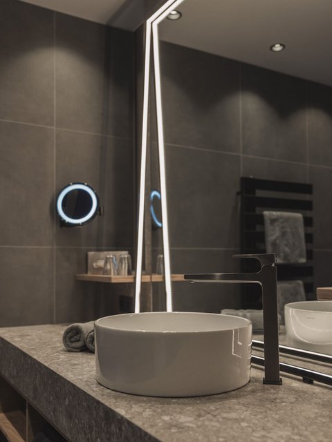 Pictures from Sportalm Modern bathroom sink with round basin and illuminated mirror