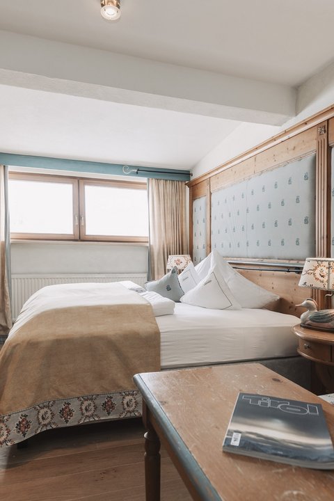Pictures from Sportalm Cozy hotel room with wooden furniture and double bed