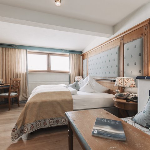 Pictures from Sportalm Cozy hotel room with wooden furniture and double bed