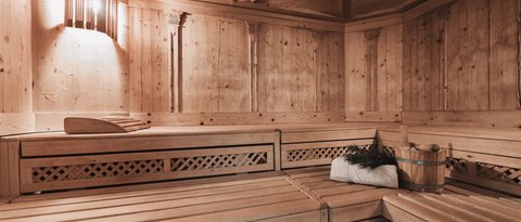 Pictures from Sportalm Wooden sauna with light, towel, bucket, and sauna whisk