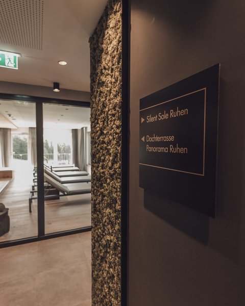 Pictures from Sportalm View of a relaxation area with lounge chairs and a sign pointing to Silent Sole and rooftop terrace