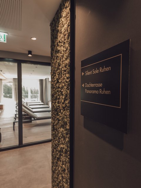 Pictures from Sportalm View of a relaxation area with lounge chairs and a sign pointing to Silent Sole and rooftop terrace