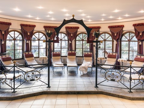 Pictures from Sportalm Calm relaxation room with lounge chairs, decorative curtains and large windows