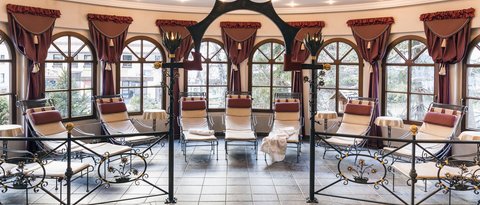 Pictures from Sportalm Calm relaxation room with lounge chairs, decorative curtains and large windows