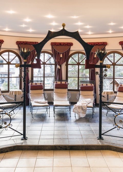 Pictures from Sportalm Calm relaxation room with lounge chairs, decorative curtains and large windows