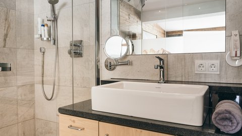 Pictures from Sportalm Bright bathroom with sink, mirror, and shower