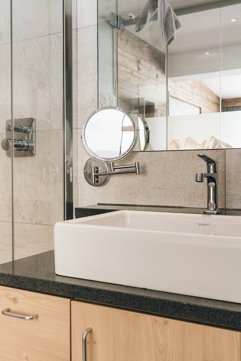 Pictures from Sportalm Bright bathroom with sink, mirror, and shower